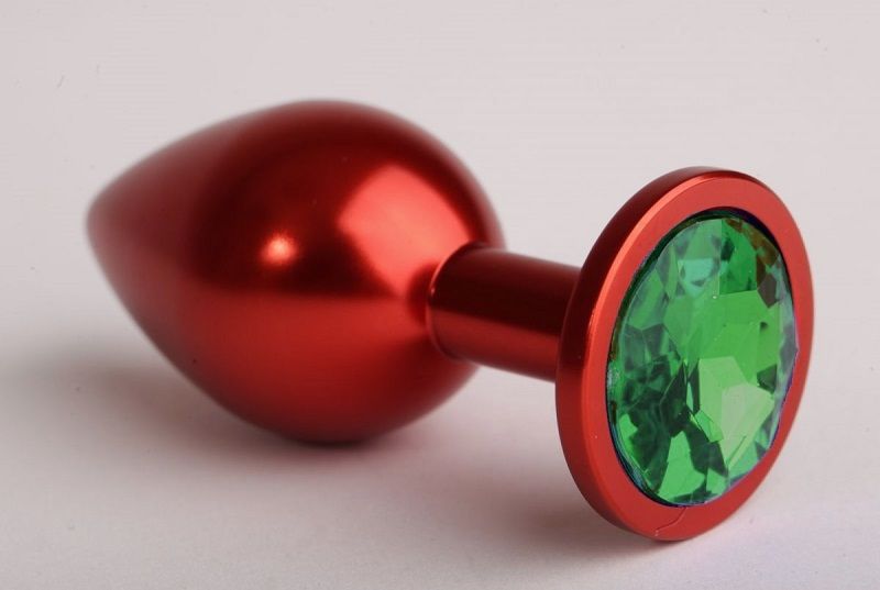 Купить Красная анальная пробка с зелёным стразом - 7,6 см. в Москве.