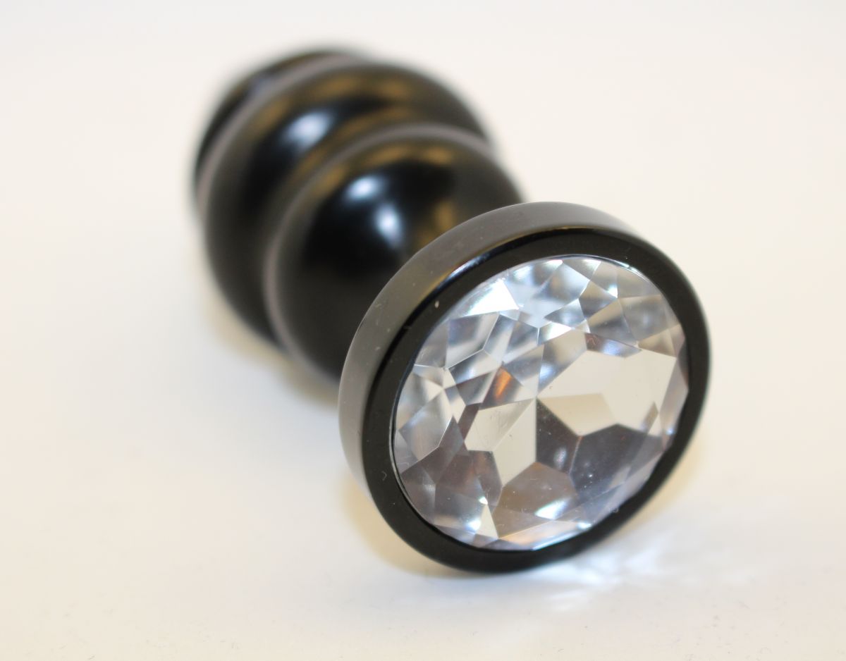 Купить Черная фигурная анальная пробка с прозрачным кристаллом - 7,3 см. в Москве.
