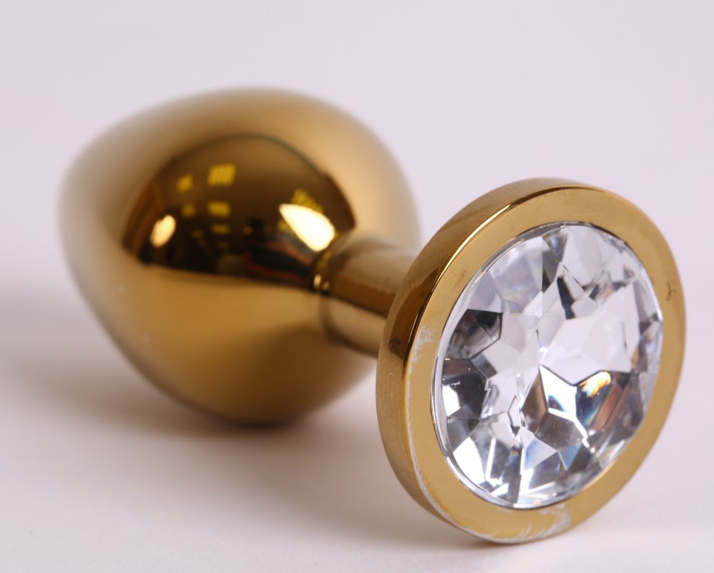 Купить Золотистая анальная пробка с прозрачным кристаллом - 8,2 см. в Москве.